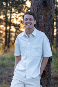 Littleton high school senior photographer sunrise photo session in Colorado Heritage ski cars swim team college bound sun Morrison photography Mt. Falcon park