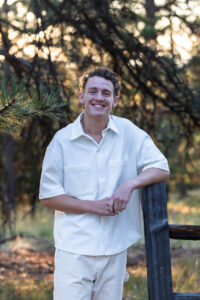 Littleton high school senior photographer sunrise photo session in Colorado Heritage ski cars swim team college bound sun Morrison photography Mt. Falcon park teenager