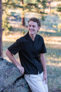 Littleton high school senior photographer sunrise photo session in Colorado Heritage ski cars swim team college bound sun Morrison photography Mt. Falcon park teenager
