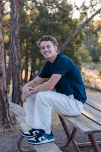 Littleton high school senior photographer sunrise photo session in Colorado Heritage ski cars swim team college bound sun Morrison photography Mt. Falcon park teenager