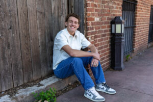Littleton high school senior photographer sunrise photo session in Colorado Heritage ski cars swim team college bound sun Morrison photography Mt. Falcon park teenager urban