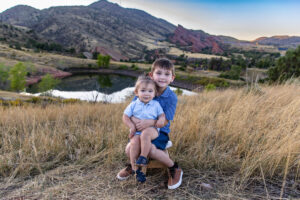 Littleton family photographer Morrison Mt. Falcon trailhead red rocks bridge urban photography sunset kids siblings sisters brothers baby boy mother father foothills Colorado