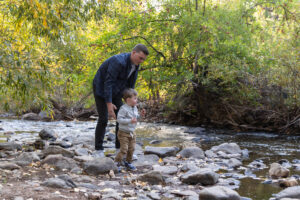 Littleton family photographer Morrison park bridge toddler boy mother father son fall dog brother Colorado photography river