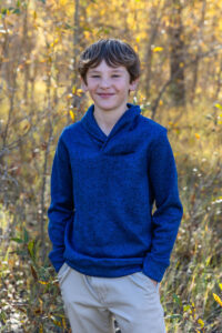 Littleton family photographer Lair O' the Bear park in Morrison Colorado yellow fall leaves trees mother father son daughter brother sister photography river bridge