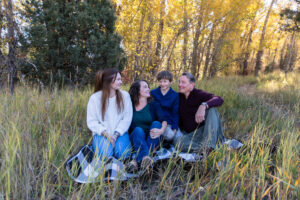 Littleton family photographer Lair O' the Bear park in Morrison Colorado yellow fall leaves trees mother father son daughter brother sister photography river bridge