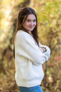 Littleton family photographer Lair O' the Bear park in Morrison Colorado yellow fall leaves trees mother father son daughter brother sister photography river bridge