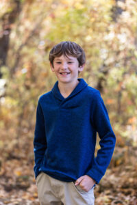 Littleton family photographer Lair O' the Bear park in Morrison Colorado yellow fall leaves trees mother father son daughter brother sister photography river bridge