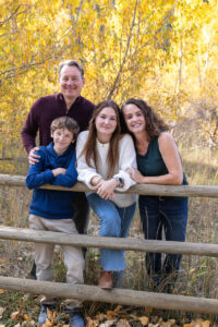 Littleton family photographer Lair O' the Bear park in Morrison Colorado yellow fall leaves trees mother father son daughter brother sister photography river bridge