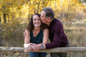 Littleton family photographer Lair O' the Bear park in Morrison Colorado yellow fall leaves trees mother father son daughter brother sister photography river bridge
