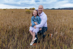 Littleton family photographer South Valley mother father child daughter photography dog dresses field Colorado