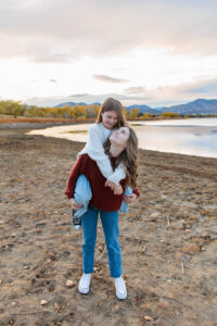 Littleton family photographer Harriman Lake Colorado girls sisters photography foothills fall leaves mother father daughters beach water