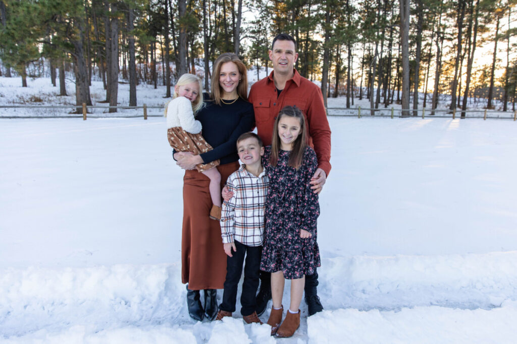 Littleton family photographer extended cousins grandparents siblings snow Dawson Butte trail Castle Rock Colorado photography evergreen trees
