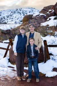 Littleton family photographer Red Rocks Amphitheatre snow boys brothers mother father sons Colorado photography