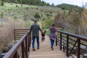 Littleton family photographer Lair O' the Bear park photography mountain foothills Colorado mother father daughter maternity baby bump
