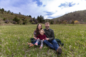 Littleton family photographer Lair O' the Bear park photography mountain foothills Colorado mother father daughter maternity baby bump