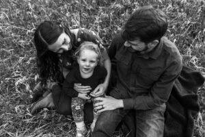 Littleton family photographer Lair O' the Bear park photography mountain foothills Colorado mother father daughter maternity baby bump