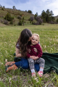 Littleton family photographer Lair O' the Bear park photography mountain foothills Colorado mother father daughter maternity baby bump