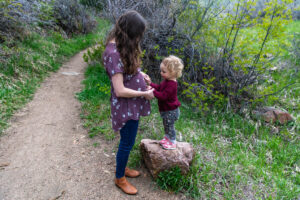 Littleton family photographer Lair O' the Bear park photography mountain foothills Colorado mother father daughter maternity baby bump