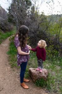 Littleton family photographer Lair O' the Bear park photography mountain foothills Colorado mother father daughter maternity baby bump