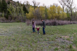 Littleton family photographer Lair O' the Bear park photography mountain foothills Colorado mother father daughter maternity baby bump