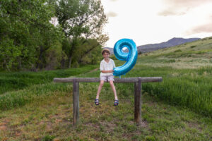 Littleton family photographer Colorado mother father son birthday photography foothills river Bear Creek state park little boy