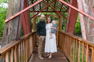 Littleton family photographer Morrison park mother father daughter little girl photography Colorado bridge river