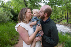 Littleton family photographer Morrison park mother father daughter little girl photography Colorado bridge river