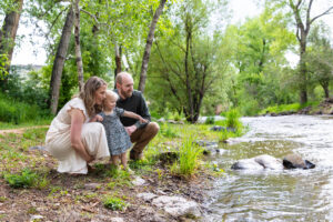 Littleton family photographer Morrison park mother father daughter little girl photography Colorado bridge river