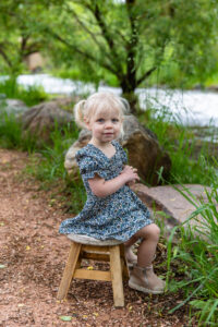 Littleton family photographer Morrison park mother father daughter little girl photography Colorado bridge river