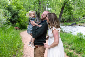 Littleton family photographer Morrison park mother father daughter little girl photography Colorado bridge river