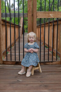 Littleton family photographer Morrison park mother father daughter little girl photography Colorado bridge river