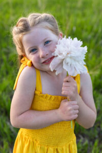 Littleton family photographer mini photo session photography Colorado mother daughter sunset golden hour fun sweet silly connection flowers