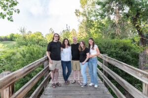 Littleton family photographer Writer's Vista park Colorado summer rainbow kids mother father son daughters bridge photography rain golden hour