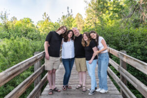 Littleton family photographer Writer's Vista park Colorado summer rainbow kids mother father son daughters bridge photography rain golden hour