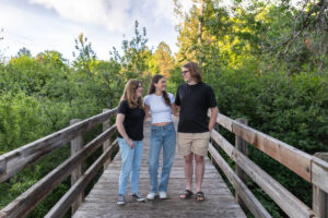 Littleton family photographer Writer's Vista park Colorado summer rainbow kids mother father son daughters bridge photography rain golden hour