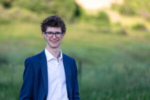 Littleton high school senior photographer Front Range Christian teen boy photography Colorado South Valley red rocks suit tech technology theater kid Class of 2026
