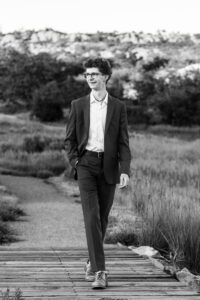 Littleton high school senior photographer Front Range Christian teen boy photography Colorado South Valley red rocks suit tech technology theater kid Class of 2026