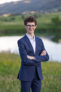 Littleton high school senior photographer Front Range Christian teen boy photography Colorado South Valley red rocks suit tech technology theater kid Class of 2026
