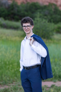 Littleton high school senior photographer Front Range Christian teen boy photography Colorado South Valley red rocks suit tech technology theater kid Class of 2026