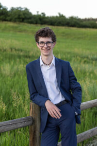 Littleton high school senior photographer Front Range Christian teen boy photography Colorado South Valley red rocks suit tech technology theater kid Class of 2026