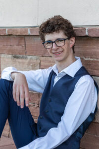 Littleton high school senior photographer Front Range Christian teen boy photography Colorado South Valley red rocks suit tech technology theater kid Class of 2026