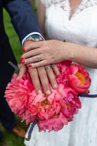 Littleton wedding photographer Colorado photography backyard ceremony flowers homemade arch kids family rain storm severe weather vows bride and groom