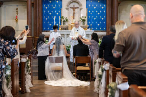 Littleton wedding photographer bride and groom Catholic ceremony Colorado photography flowers Mass married marriage church ceremony Spanish family