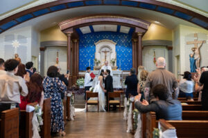 Littleton wedding photographer bride and groom Catholic ceremony Colorado photography flowers Mass married marriage church ceremony Spanish family