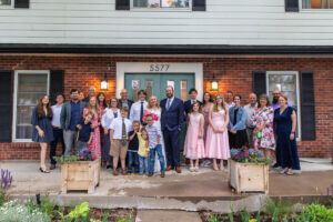 Littleton wedding photographer Colorado photography backyard ceremony flowers homemade arch kids family rain storm severe weather vows bride and groom