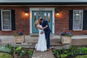 Littleton wedding photographer Colorado photography backyard ceremony flowers homemade arch kids family rain storm severe weather vows bride and groom