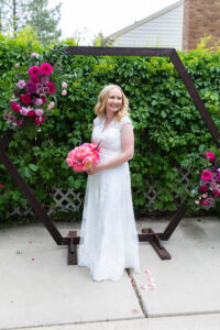 Littleton wedding photographer Colorado photography backyard ceremony flowers homemade arch kids family rain storm severe weather vows bride and groom