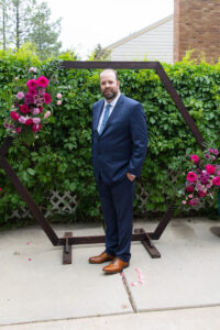 Littleton wedding photographer Colorado photography backyard ceremony flowers homemade arch kids family rain storm severe weather vows bride and groom