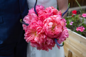 Littleton wedding photographer Colorado photography backyard ceremony flowers homemade arch kids family rain storm severe weather vows bride and groom