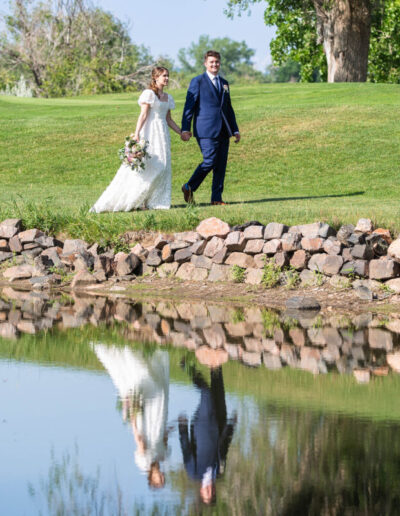 Littleton wedding photographer golf course Colorado photography lake water reflection bride groom married marriage reception ceremony